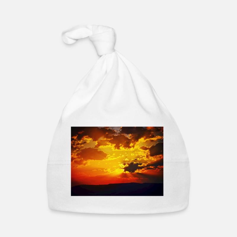Rayons de feu du coucher de soleil Bonnet bio Bébé