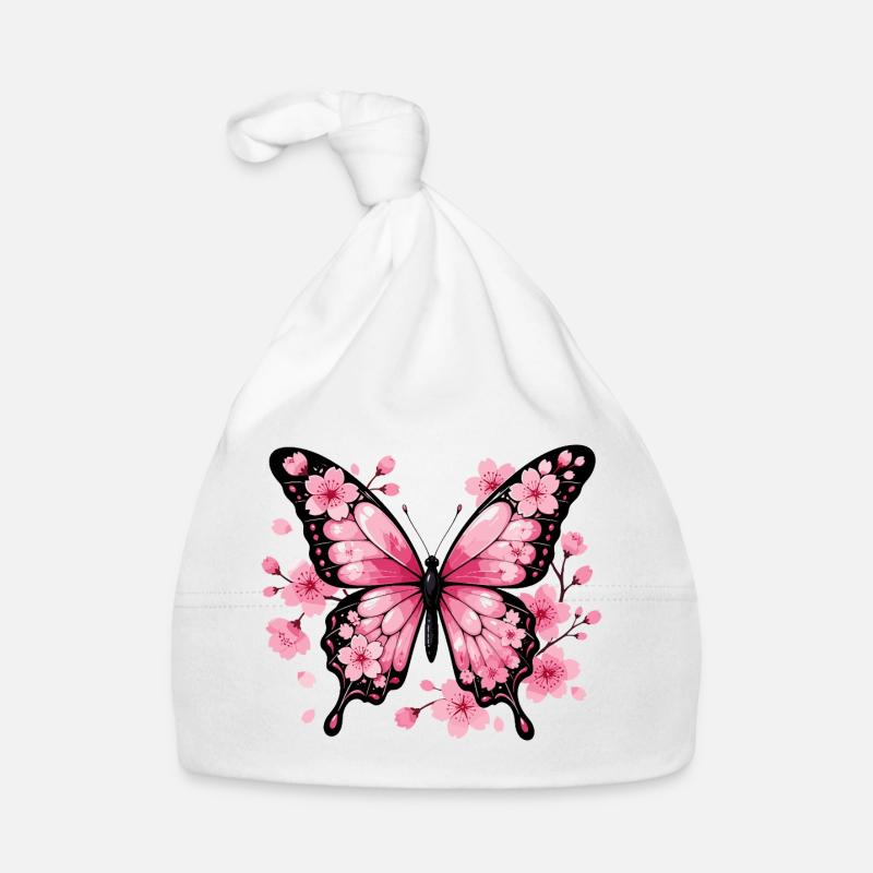 Papillon rose devant des cerisiers en fleurs Bonnet bio Bébé