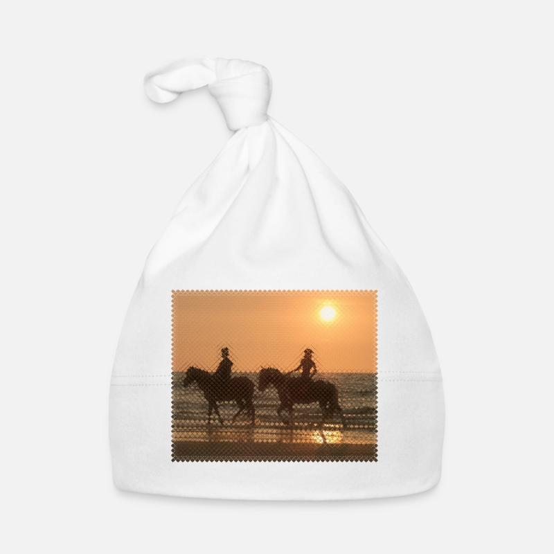 Cavalier au coucher du soleil sur la plage Bonnet bio Bébé