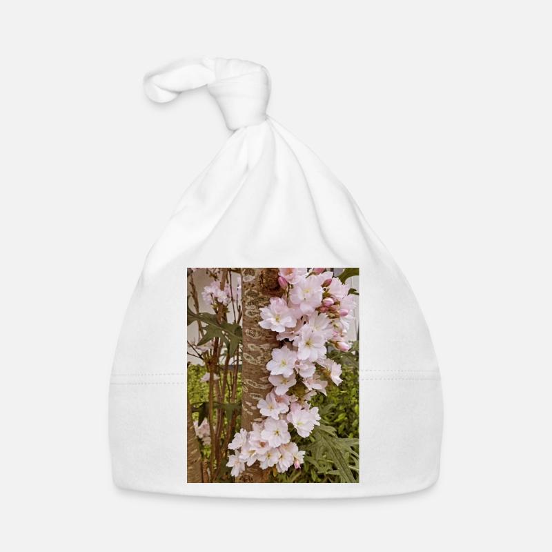 Fleurs de cerisier délicates sur tronc d’arbre Bonnet bio Bébé