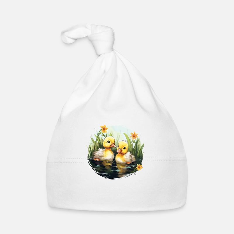 Deux mignons bébés canards dans l’étang Bonnet bio Bébé