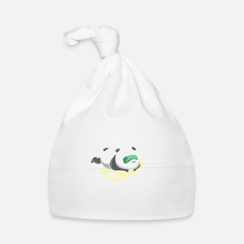 Un grand panda blanc dort. Bonnet bio Bébé
