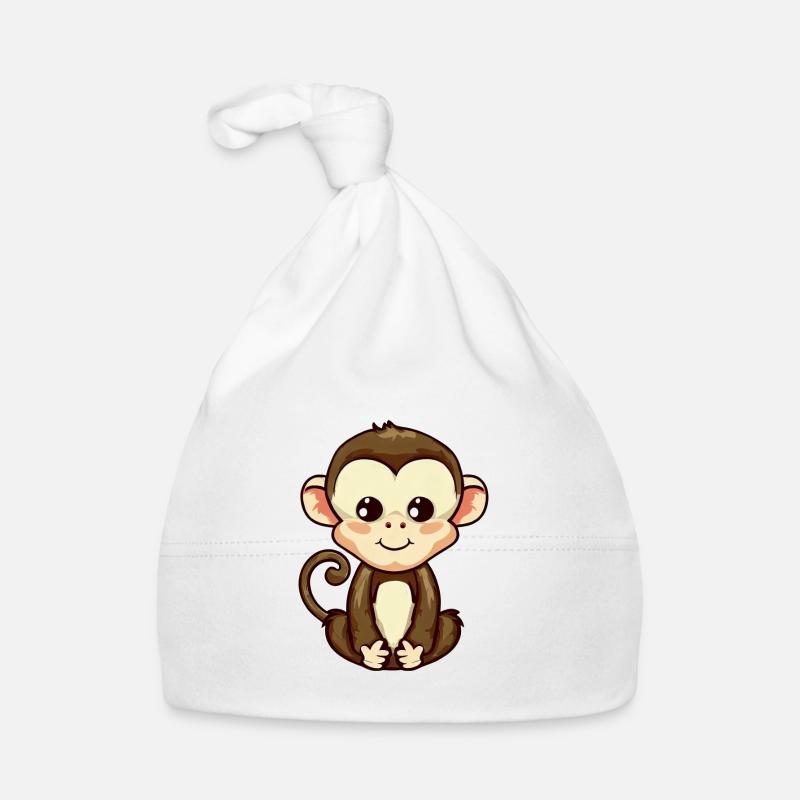 Affe sitzt, meditiert und entspannt Baby Bio-Mütze