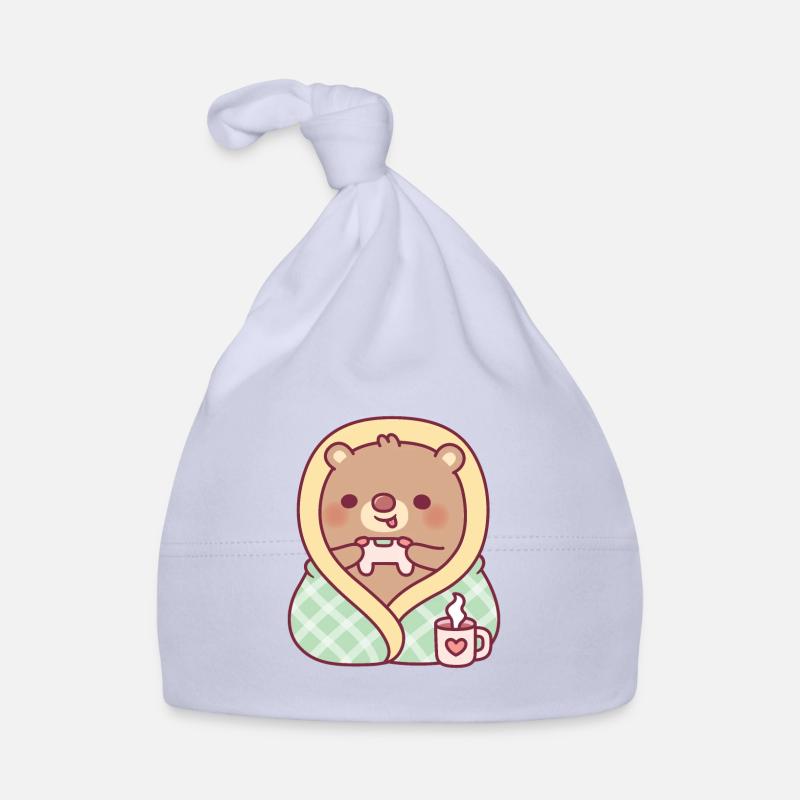 Ours mignon enveloppé dans une couverture douillette pendant le jeu Bonnet bio Bébé