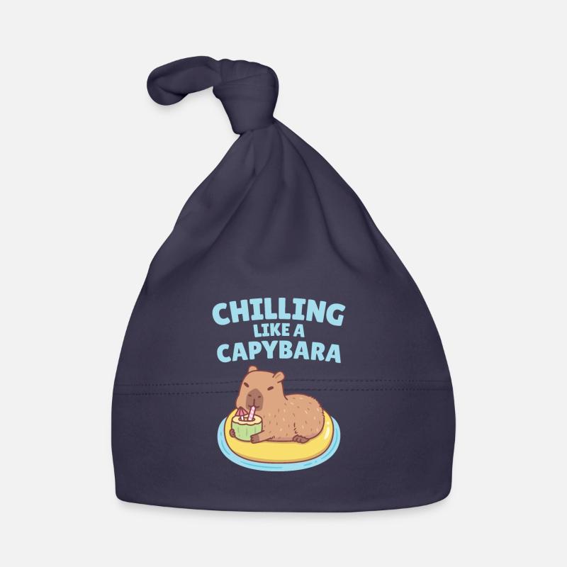 Capybara sur flotter sur la piscine refroidissant comme un Capybara Bonnet bio Bébé
