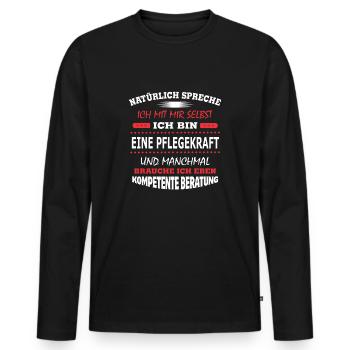 EINE PFLEGEKRAFT - Männer Premium Bio Langarmshirt - Schwarz - Vorne - Nico (187cm)