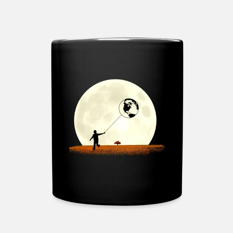 Boy on meadow pulls earth in front of moon - Full Colour Mug - black