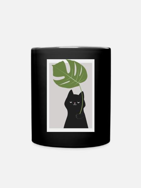 Lustige Katze, die Monstera-Pflanzenblätter hält - Tasse einfarbig - Schwarz