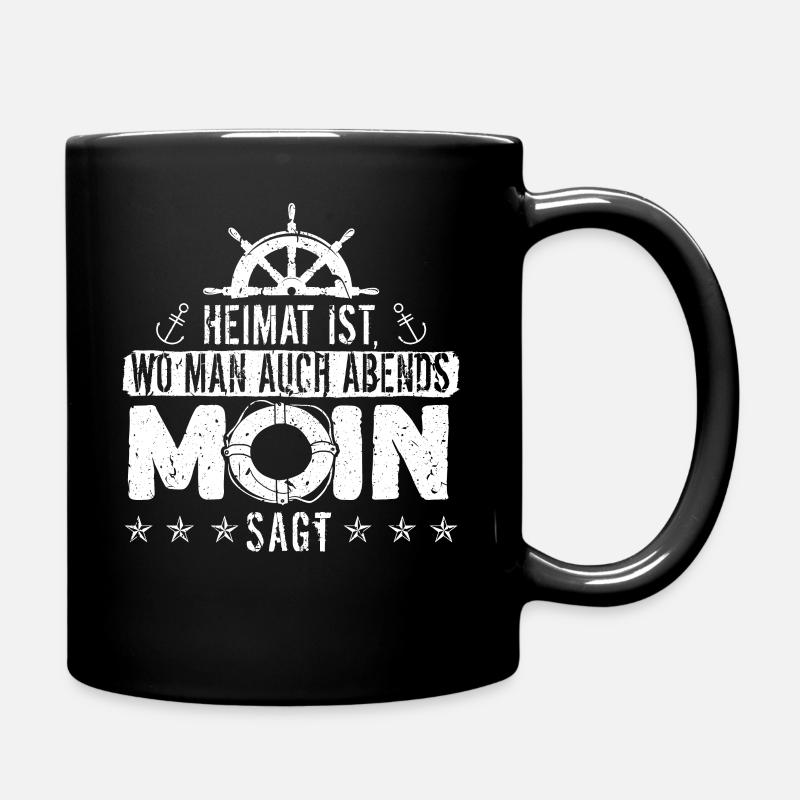Heimat ist wo man auch Abends Moin sagt Ostee - Tasse einfarbig - Schwarz