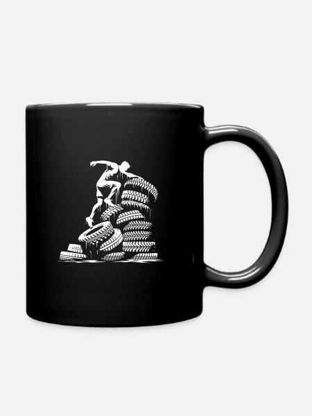 Climbing over a tower of tires - Full Colour Mug - black